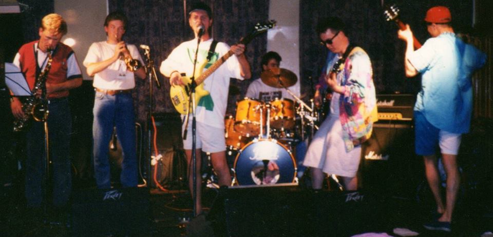 Ice Station Penguin performing together on stage